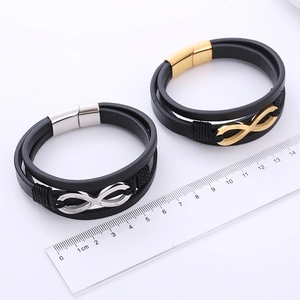 Infinity symbol braided leather bracelet with magnetic clasp in silver and gold tone