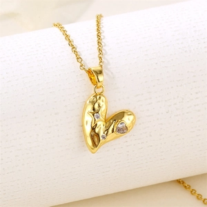 Elegant gold heart necklace with hammered texture and small clear crystals for women