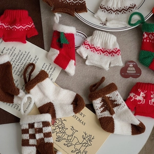 Miniature Christmas knit ornaments set featuring red and green sweaters and socks