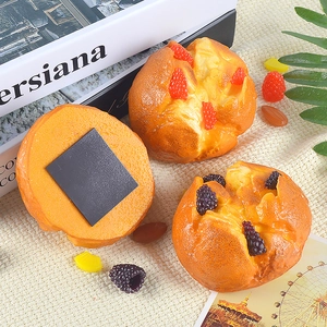 Realistic artificial mini muffins and bread fridge magnets with realistic berry decorations