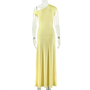 Detail of light yellow one-shoulder maxi dress with ruched waist and elegant slim fit