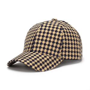 Detailed view of the houndstooth pattern and knit texture on this stylish baseball cap