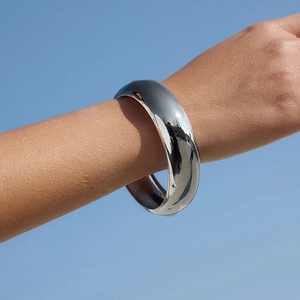 Minimalist 18K gold plated stainless steel chunky bangle with a mirror polished finish