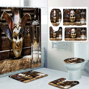 Detail view of a 4-piece bathroom set with Venetian mask print on wood background