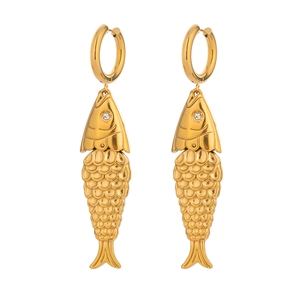 Detail of gold fish-shaped earrings with polished finish and sparkling crystal eyes