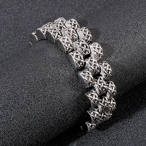 Retro mens stainless steel bracelet featuring intricate celtic knot textured weave pattern
