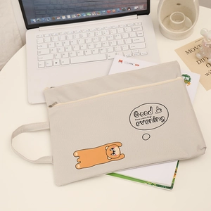 Waterproof A4 cartoon bear oxford document bag with handle shown on a modern white desk