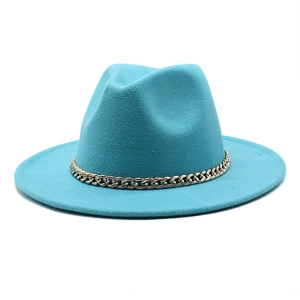 Detail of lake blue fedora hat featuring a chunky gold metal chain on the crown
