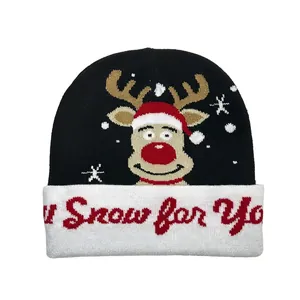 Detail of Christmas reindeer knit beanie with Snow for You red lettering on white cuff