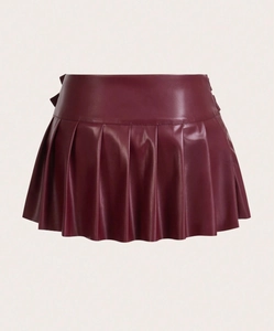 Detailed view of wine red PU leather pleated mini skirt with side slit detail