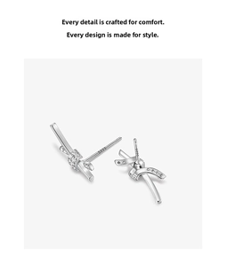 Close-up of S999 sterling silver knot earrings with zircon inlay and hallmark
