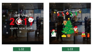 Detail of Merry Christmas electrostatic window decals with Santa and snowflake motifs