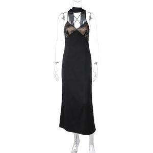 Detail of elegant black satin long dress featuring fine lace patchwork on the V-neckline