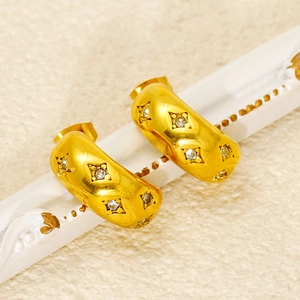 Golden C-shaped stainless steel earrings with diamond pattern and sparkling crystals