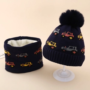 Detail of fleece lining and jacquard car patterns on kids winter hat and scarf set