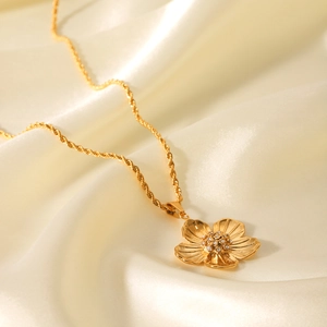 Golden flower pendant necklace with twist chain on silk, vintage luxury stainless steel style