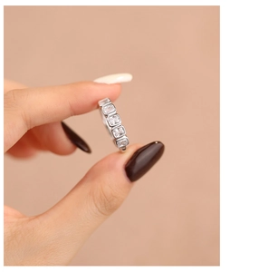 Macro shot of s925 silver ring featuring five rectangular sparkling zircon stones
