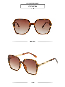Detail view of leopard frame sunglasses with gradient tea lenses and gold metal chain temples