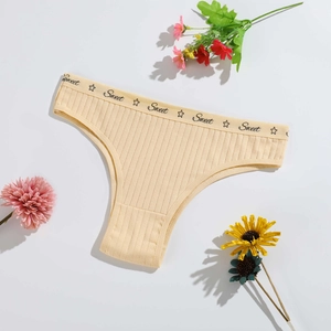 Pale yellow ribbed cotton panty for women with Sweet lettering on a white background