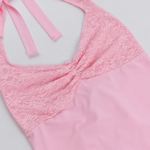 Detailed view of pink floral lace texture and stitching on a halter neck bodysuit