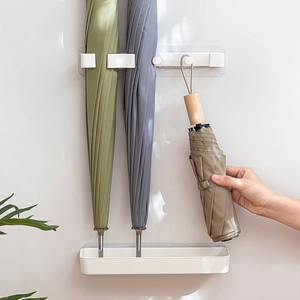 Minimalist wall-mounted umbrella rack with drip tray for long and folding umbrellas