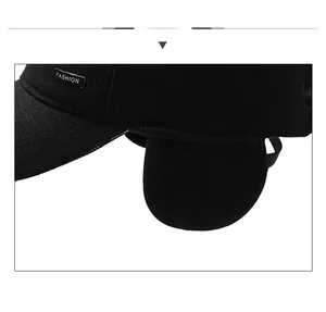 Detail view of winter baseball cap featuring warm earflaps and fashion metal logo