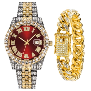 Macro detail of luxury men's iced-out watch and gold Cuban link bracelet set