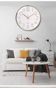 Detailed close-up of 12-inch silent wall clock with rose gold numbers and quartz movement
