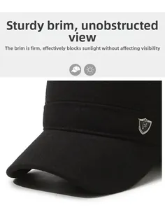 Close-up of a black wool flat top military cap featuring a metal F badge and stiff brim