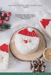 Close-up of Santa Claus candle with imported paraffin and cotton wick on wood tray