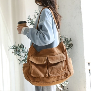 Brown canvas messenger bag with multi-pocket utility design for casual daily wear