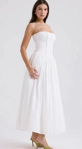 Full view of elegant white sleeveless maxi dress with lace trim and slimming waistline