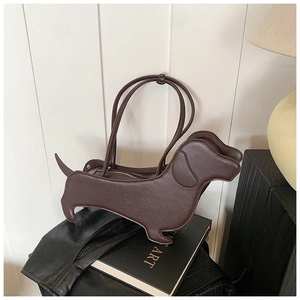Detail of creative brown leather dachshund dog-shaped tote bag showing smooth leather texture