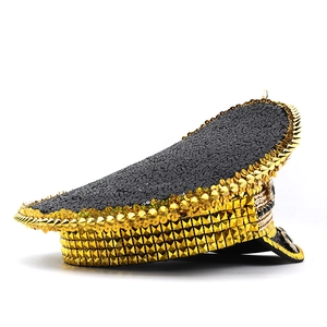 Detail of bohemian festival captain hat with gold studs and sequins on black finish