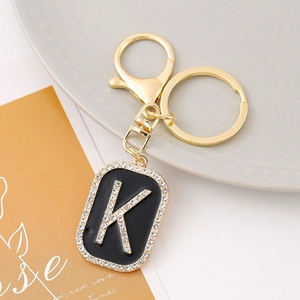 Macro shot of letter K keychain with gold plating and sparkling crystal rhinestones