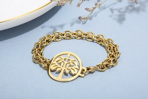 Close-up of golden stainless steel double layer bracelet with Tree of Life pendant