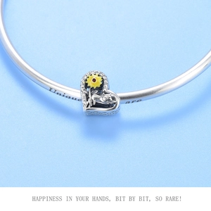 Detail of S925 silver heart charm with yellow sunflower and cat on bracelet