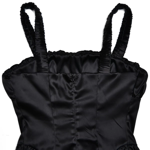 Close-up of black satin dress with ruched shoulder straps and back zipper detail