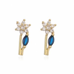 Elegant gold flower stud earrings with white zircons and a blue marquise stone petal