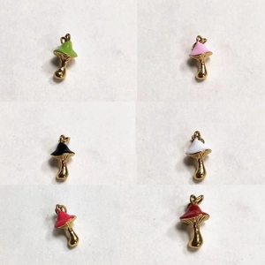 Detailed grid of colorful enamel mushroom charms with golden hooks for jewelry making