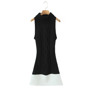 Detail of knit mini dress showing turtleneck and contrasting black and white textures