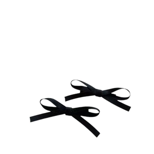 Pair of elegant black satin ribbon bow hair clips for women on a white background
