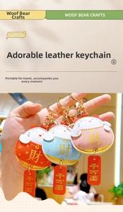 Detail of cute lucky cat leather keychains with gold metal rings for couple bags
