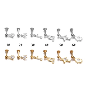316L stainless steel labret studs set with hamsa hand, star, and music note charms