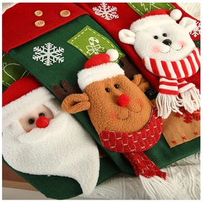 Detailed view of Christmas stockings with 3D Santa and reindeer knitted characters