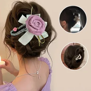 Elegant purple rose hair claw clip with light green ribbon bow for women's updo styles