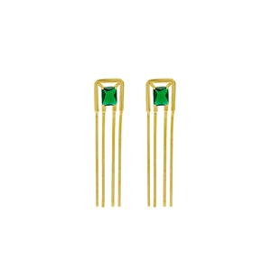 French vintage style square emerald earrings with golden tassels on a white background