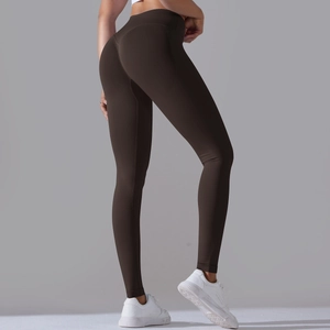 Detail shot of seamless high waist yoga pants in coffee brown with peach lift sculpting