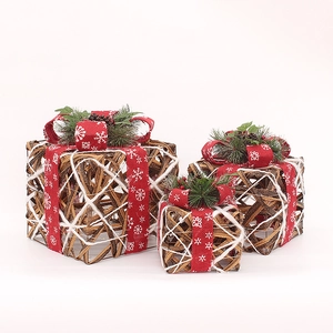 Three-piece set of natural rattan Christmas gift boxes with red snowflake ribbons and pine cones