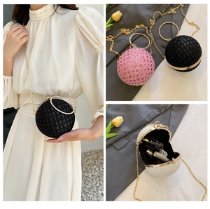Macro detail of sparkly spherical evening bag with rhinestones and metal chain strap